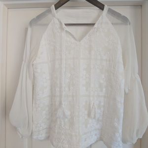 White blouse with embroidery.